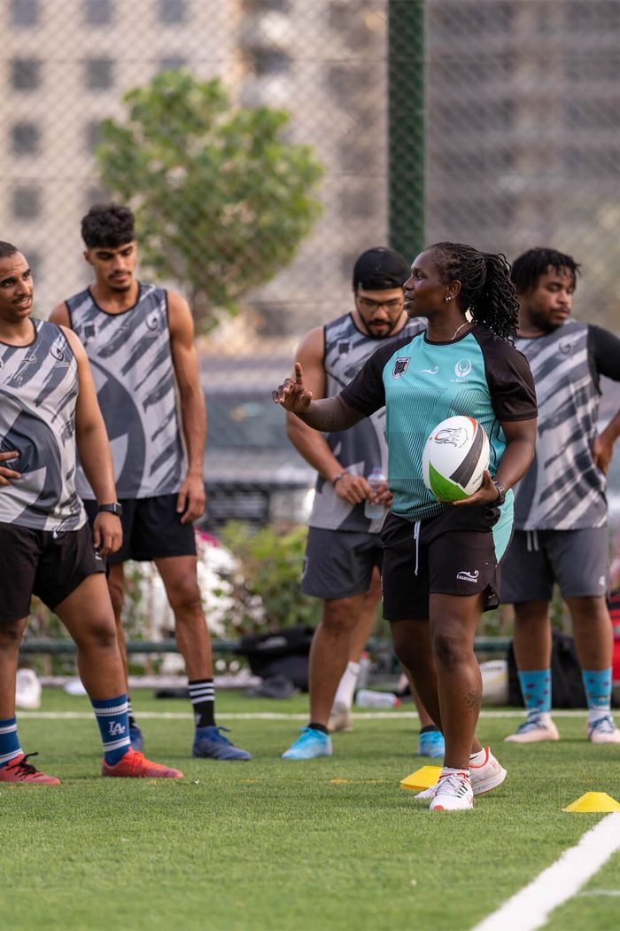 Rugby squad huddled on the turf